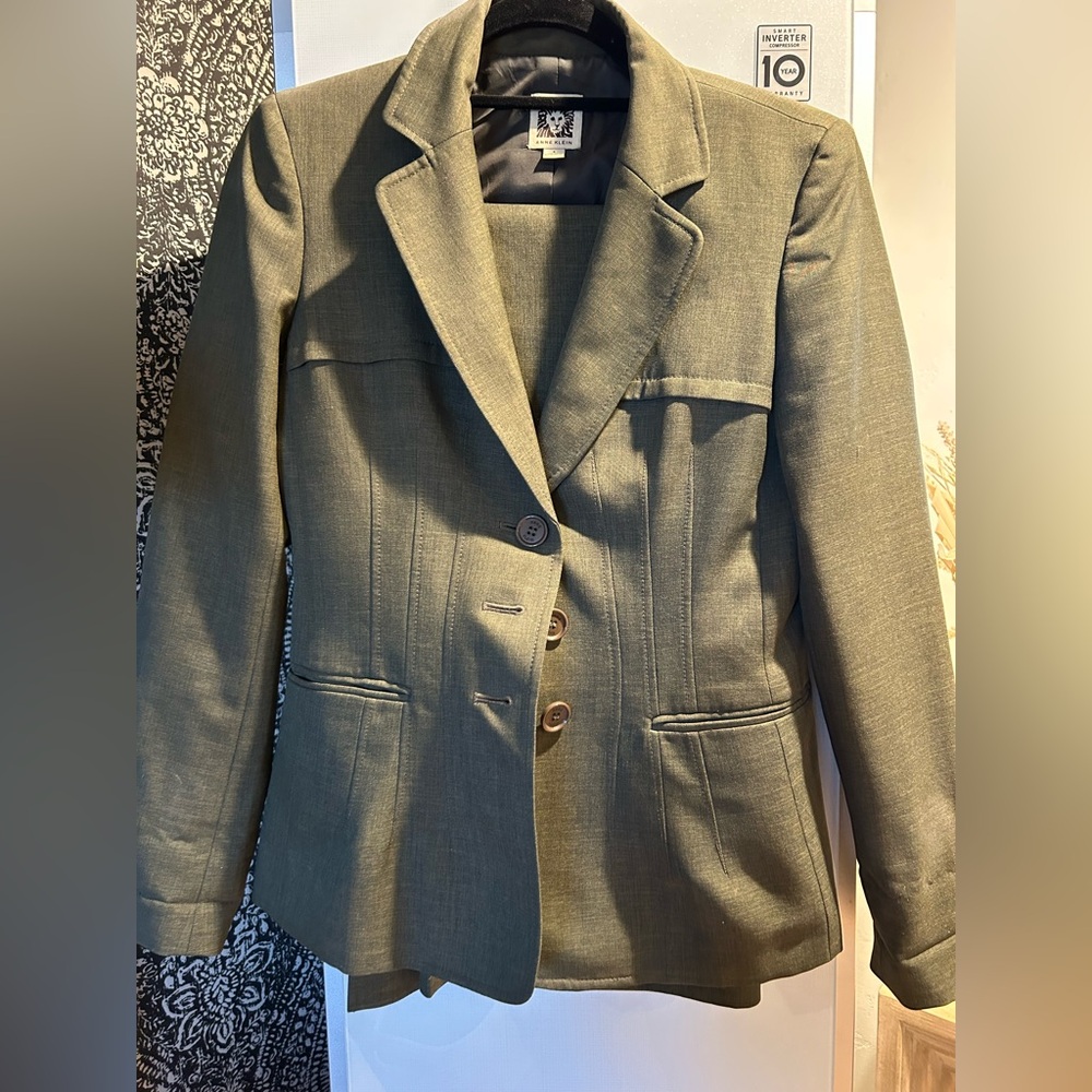 Olive green pants suit.